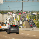 Elevated view of traffic congestion with toll pricing signage visible in foreground