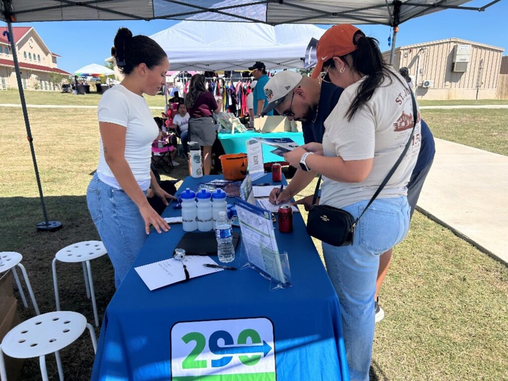 The 290 Extension Project Team meets with community members at the St. Joseph Catholic Church Fiesta on October 10, 2026.